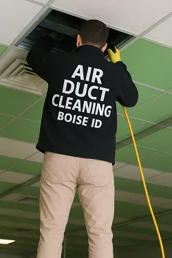Technician providing Air Duct Cleaning Boise ensuring safe and efficient dryer performance.