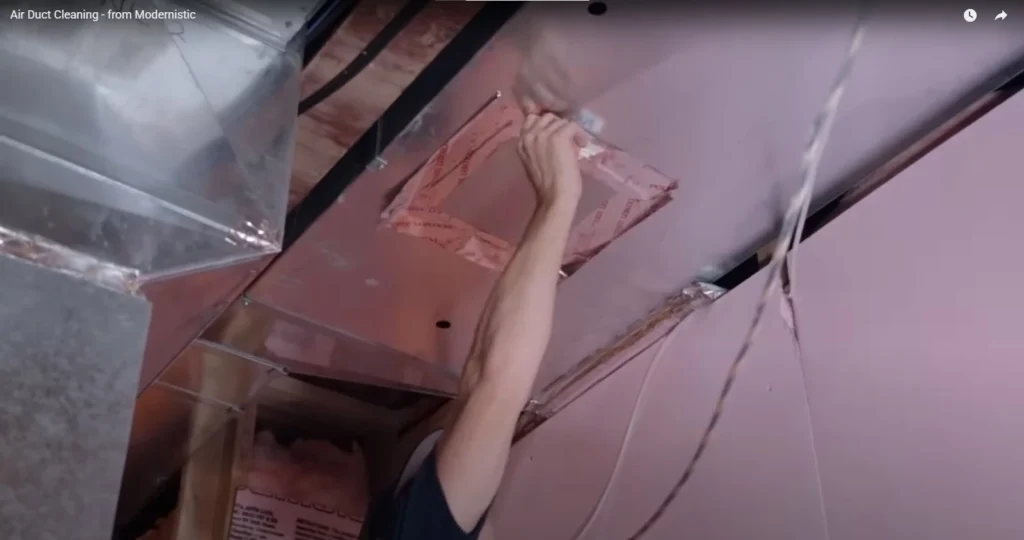 Technician performing professional air duct cleaning in Meridian ID home